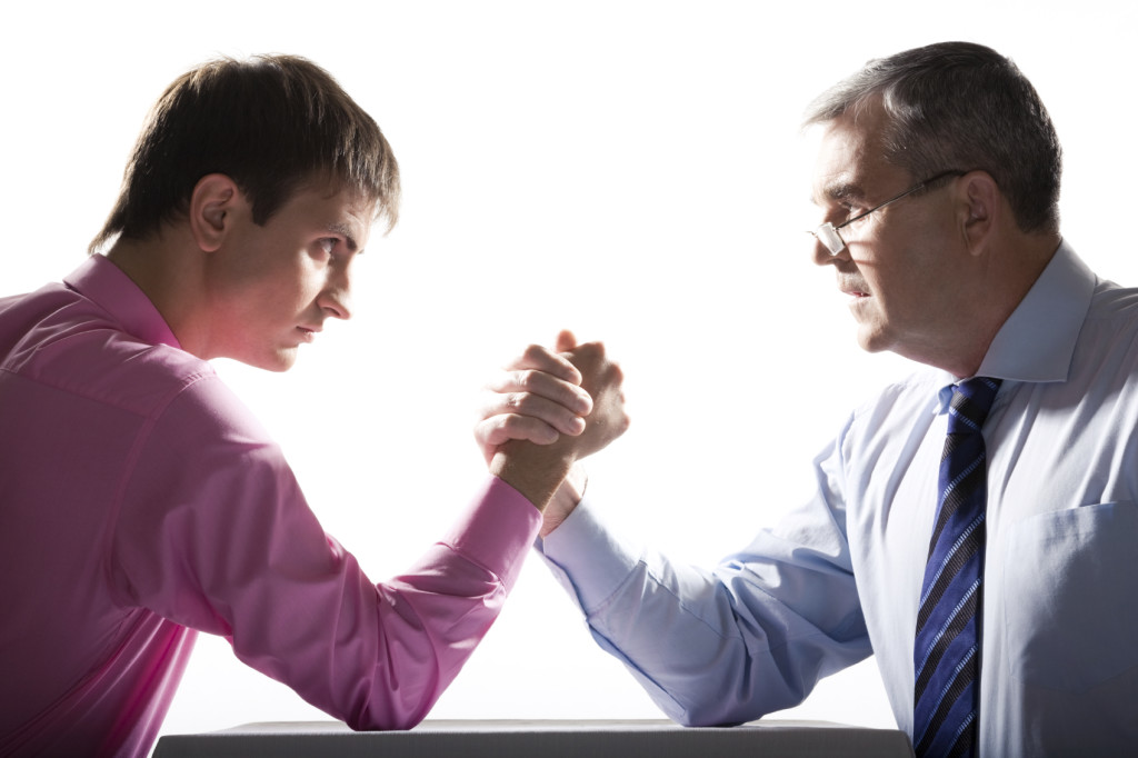 Portrait of two businessmen fighting over white background Note to inspector: the image is pre-Sept 1 2009